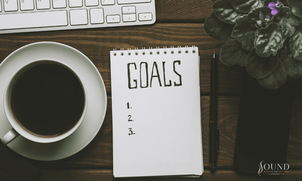 Woman chopping apples in a bright kitchen.