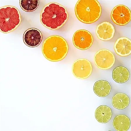 Assorted citrus fruits on a white background
