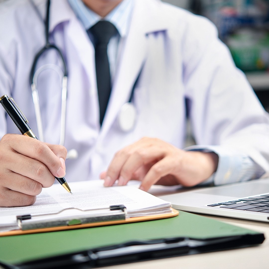 Smiling woman engaged in conversation with professional.